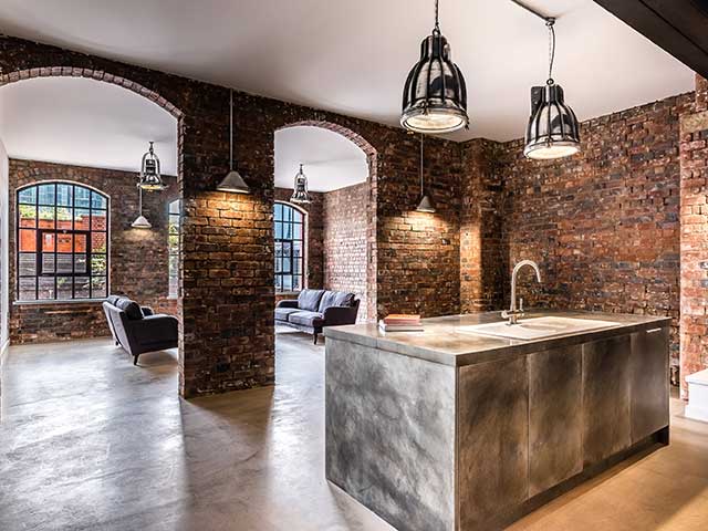 Hotel interior design ideas featuring exposed brick and polished concrete floors