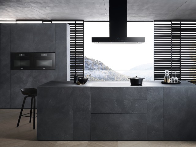 quiet cooker hood from Miele in large modern grey handless kitchen