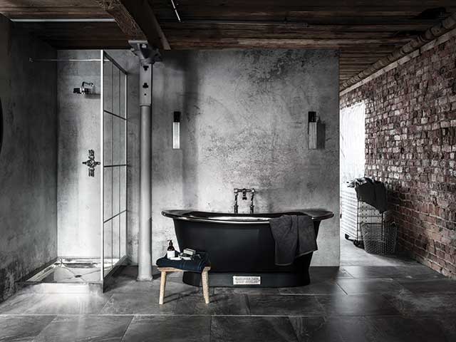 Hotel inspired bathroom with factory windows in black and grey