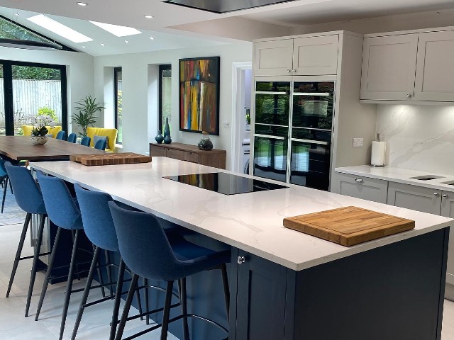 modern kitchen extension with large kitchen island, modern appliances and skylights