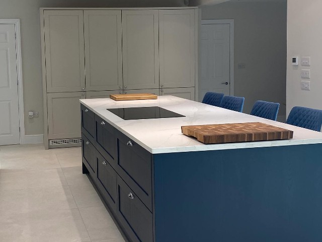 kitchen extension with large kitchen island painted blue with marble worktop