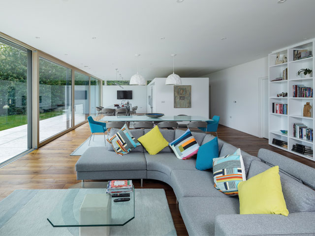 Noise reduction windows in a large open-plan living space  with floor-to-ceiling windows