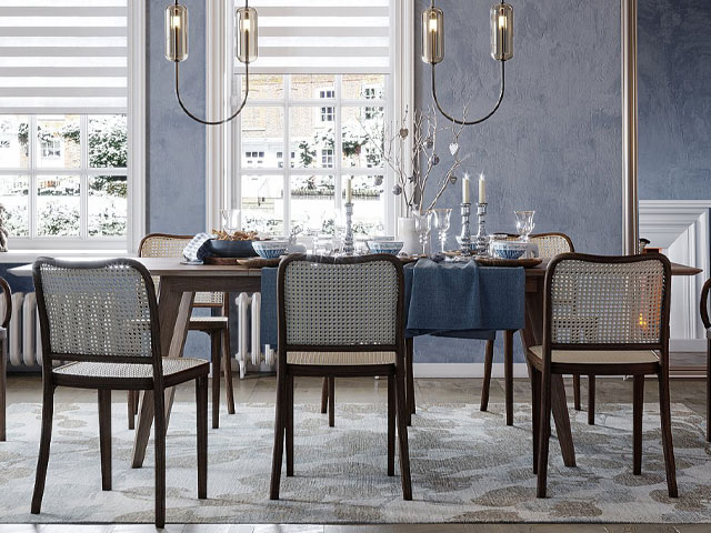 Pure oak extending dining table from Pepper Sq with cane chairs in a large room