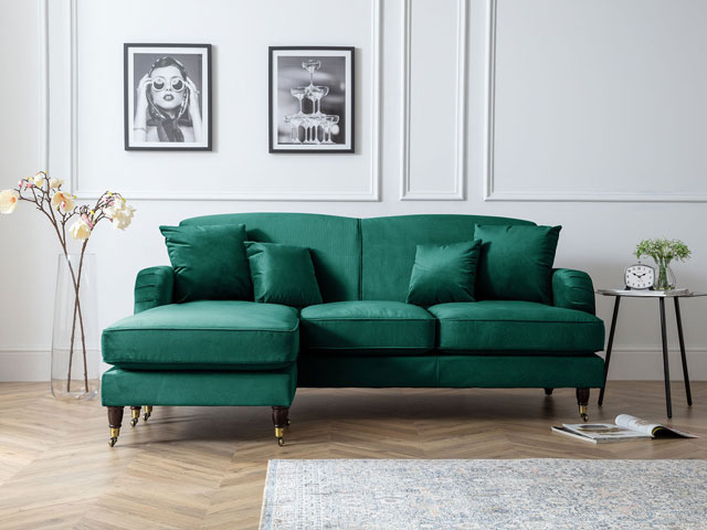 teal couch with chaise, traditional style, wooden legs on brass castors in renovated cottage