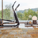 luxury home gym equipment: Technogym Cross Personal Trainer in hoe gym with a view of the countryside