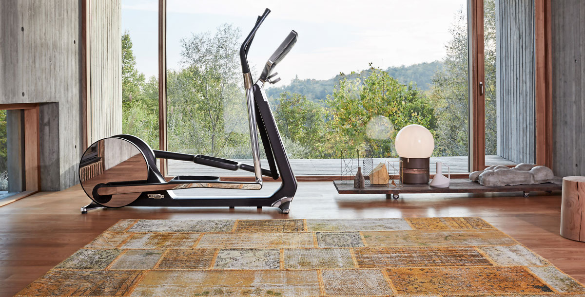 luxury home gym equipment: Technogym Cross Personal Trainer in hoe gym with a view of the countryside