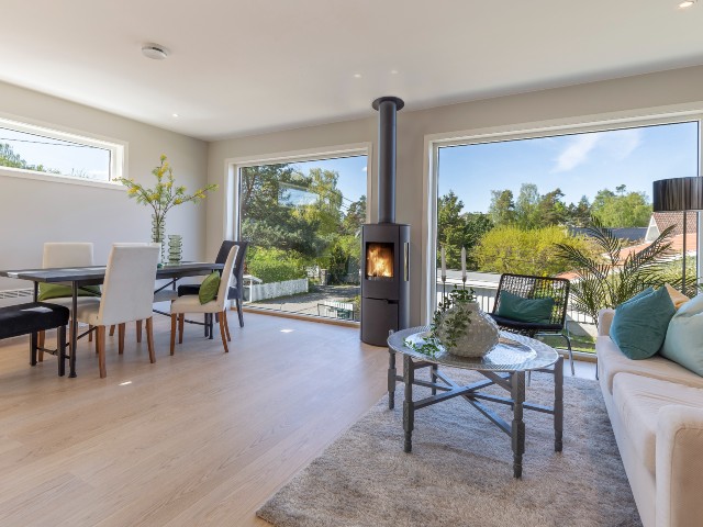 wood burning stove with chimney in a contemporary new build with large picture windows