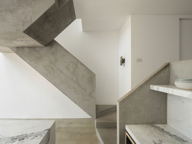 A striking concrete staircase in a Victorian house in London