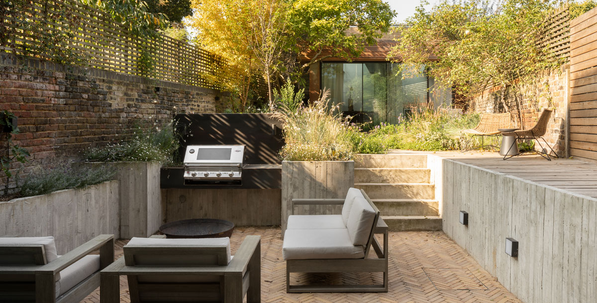 sunken patio garden to the rear of a Victorian semi with Corten steel cladding extension