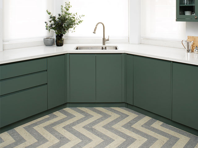 Linoleum kitchen flooring in a zig-zag pattern. It is biodegradable and durable. Made from linseed oil, wood flour, pine resin and environmentally responsible dyes, it comes in all sorts of designs