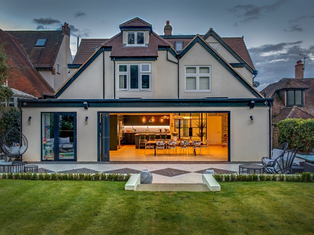 rear kitchen extension on a 1930s house with fully opened sliding doors