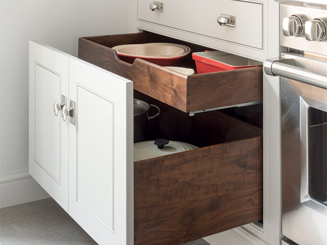 deep drawer with a shallower drawer inside to store pans and baking trays