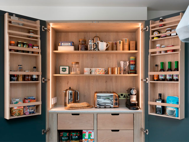 wooden kitchen pantry with coffee station and forest green cupboards