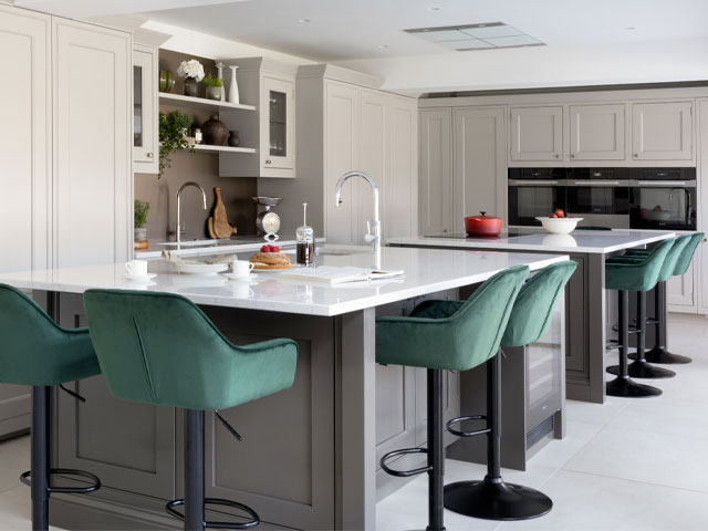 Amblecote kitchen with large kitchen island and forest green bar stools