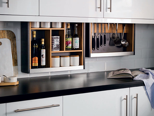 Motorised utensil storage that drops down from wall-hung cabinets