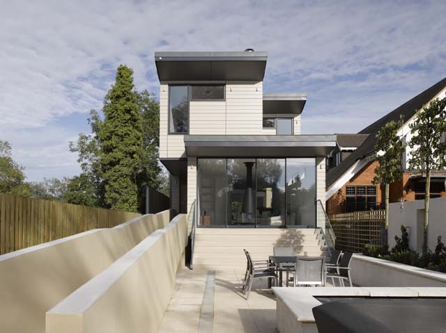 The rear of the contemporary riverside build with flood-proofing measures