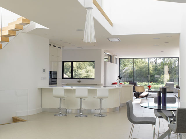The bright white interior of the Thames house Oxfordshire riverside house featured on Grand Designs