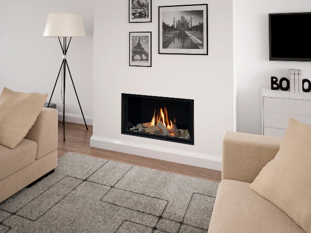 gas fire with black mirror glass liners against a white wall