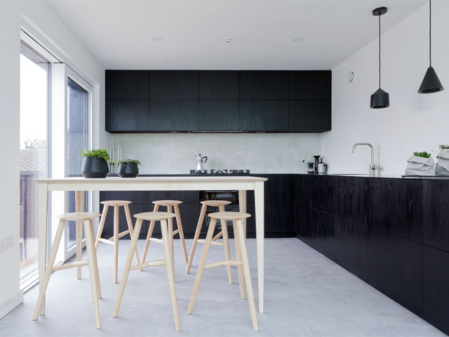 The minimalist black kitchen in Joe and Lina's affordable Passivhaus build from Grand Designs 