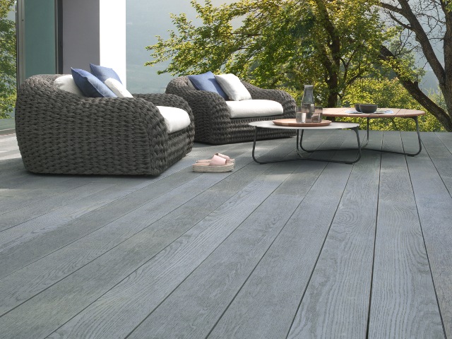 grey composite decking with rattan garden furniture in a contemporary style