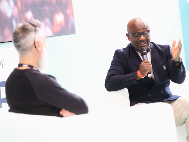 Kunle Barker quizzes Olaf Mason about his self-build project at Grand Designs Live in 2021