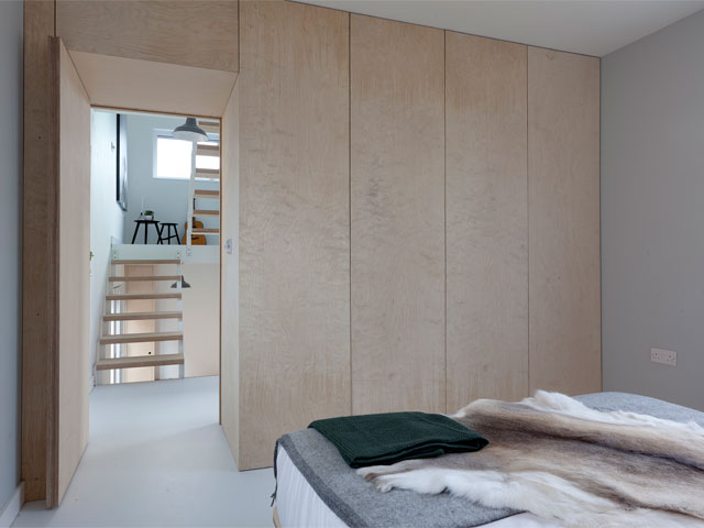 The timber-clad bedroom of Joe and Lina's Passivhaus