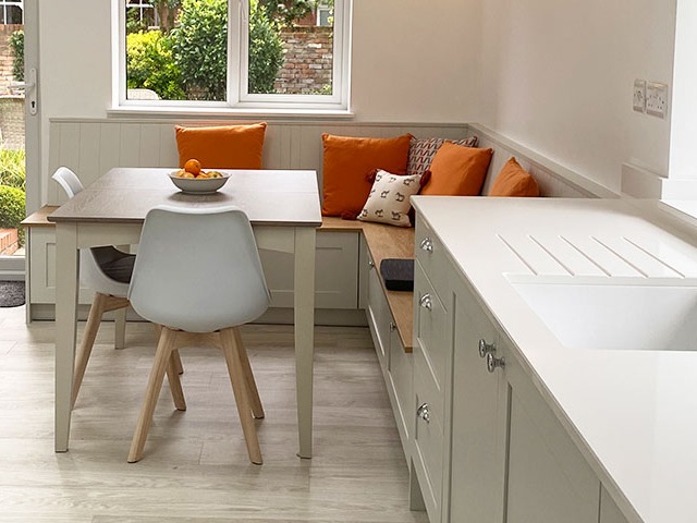 space saving kitchen ideas: cosy breakfast nook with storage bench in kitchen-diner