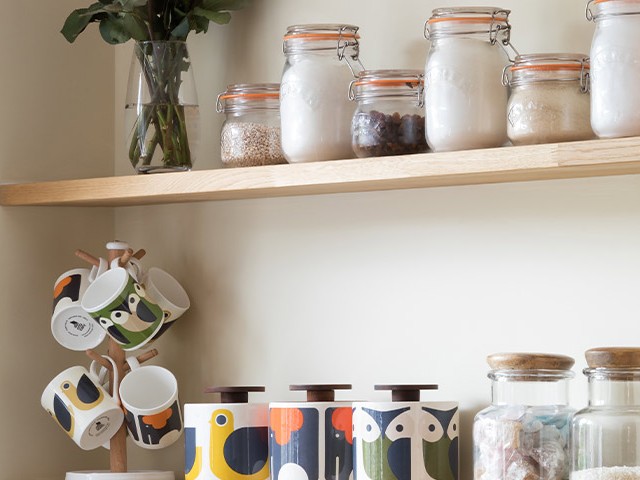 kitchen storage shelves with kilner jars and matching tea caddy and mug set
