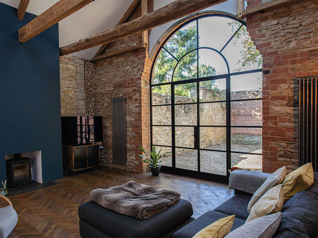 This 18th Century barn in Leicestershire is in a conservation area, so the Crittall Corporate W20 steel-arched replacements, supplied by Three Spires Glass, had to be passed by planning. Photo: Squib Photography