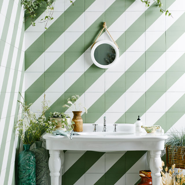 80s-style bathroom with green and white diagonal striped tiles