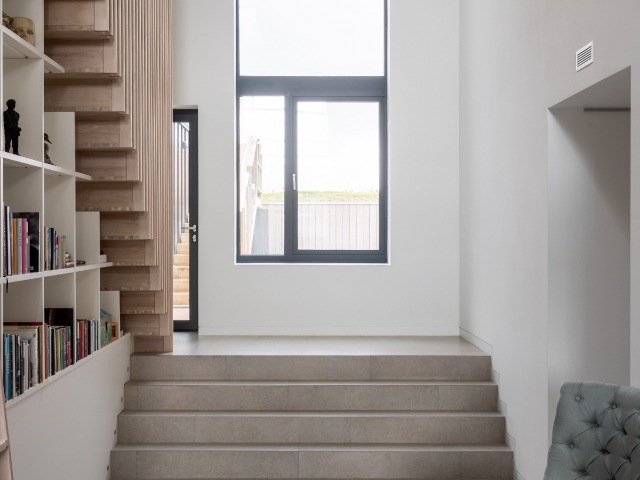 hallway with concrete and timber staircase in a passivhaus self build