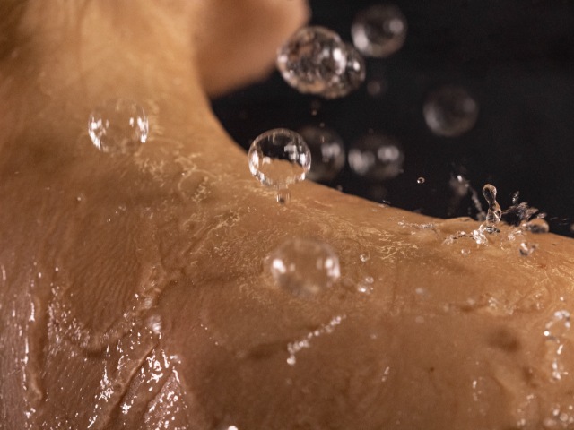 water bubbles popping on the skin
