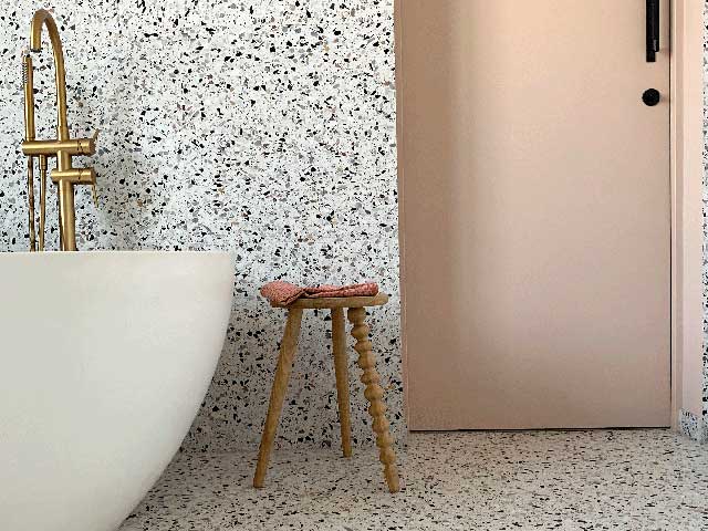 Terrazzo flooring and wall tiles in bathroom space 