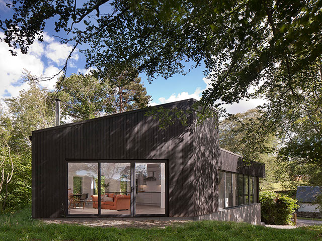 Homes under 200k black with trees in background