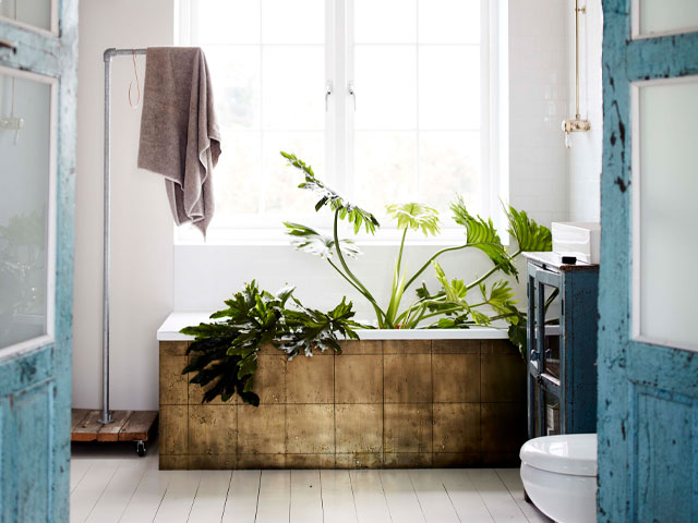 salvaged brass tiles on a bath