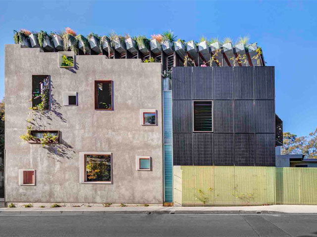 This carbon neutral home has passive thermal regulation throughout, as well as a smart rooftop garden and interior glass wall