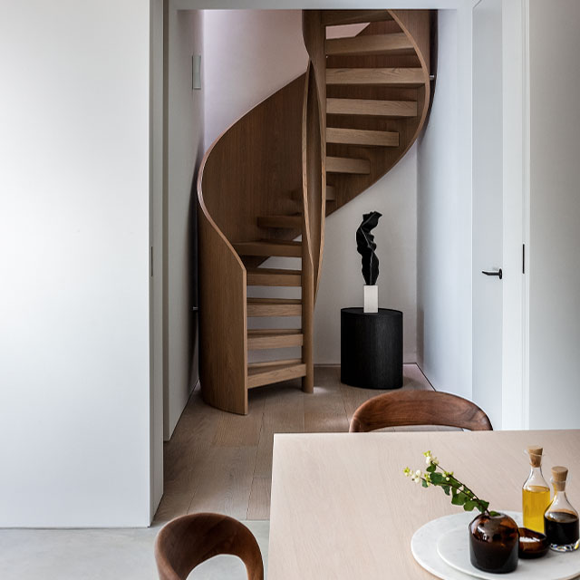 Skylight above a helical timber staircase in this Knightsbridge house