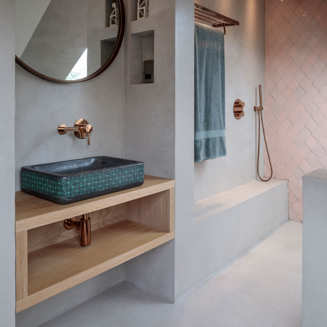 microconcrete floor in bathroom with built in basin and shower