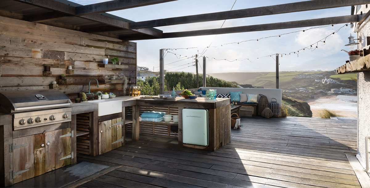 outdoor kitchen ideas: kitchen on a decked area in cornwall coastal cottage