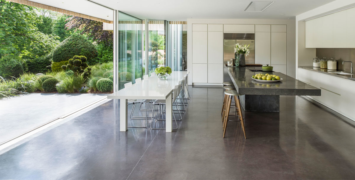 polished concrete floor running from kitchen to outdoor terrace