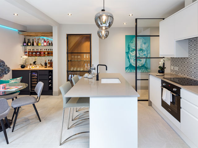 Zaluga Developments removed a structural wall between the dining room and kitchen in this Putney apartment