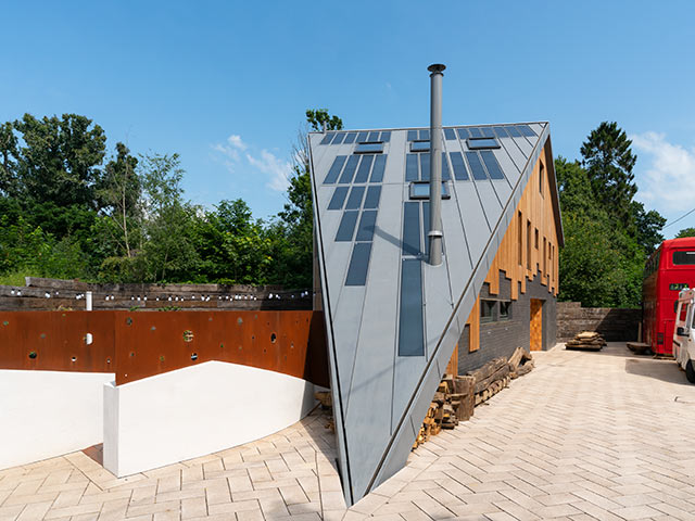 Triangle house using renewable energy systems with solar panels