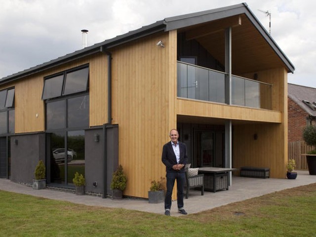 Kevin McCloud outside an accessible home from Grand Designs