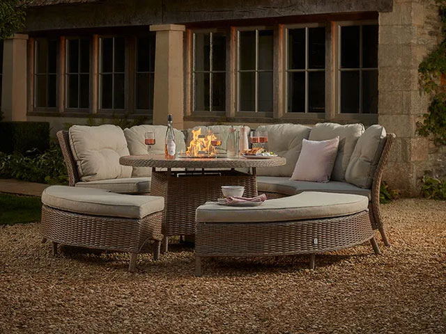 Gravel garden in dusk with circular cushion outdoor furniture