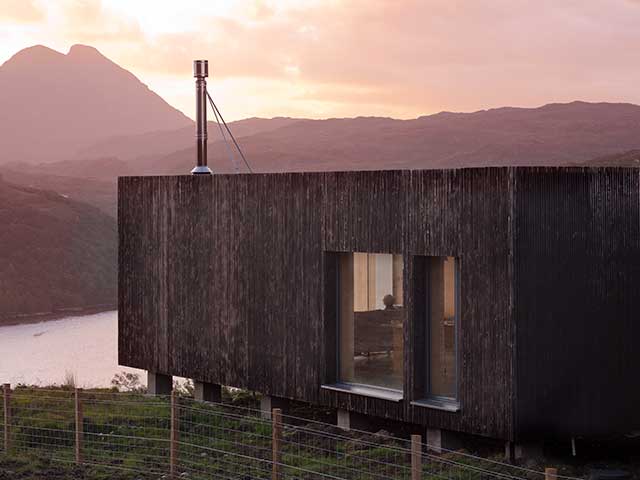 A timber-clad modular build in a remote location in the Scottish highlands