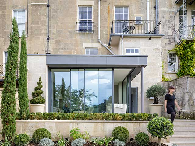 Period duplex apartment in Bath with glass bifold doors opening to courtyard garden