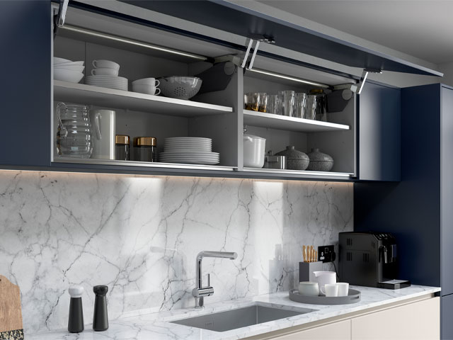 navy lift-up kitchen cabinet doors with marble splashback
