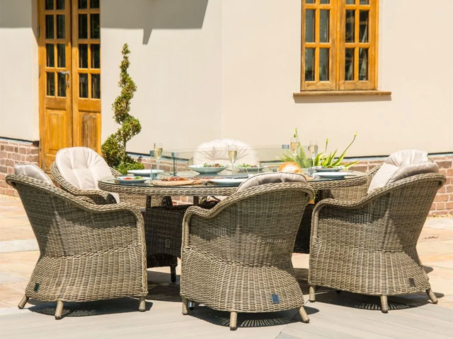 rattan garden set with firepit and traditional rattan garden chairs