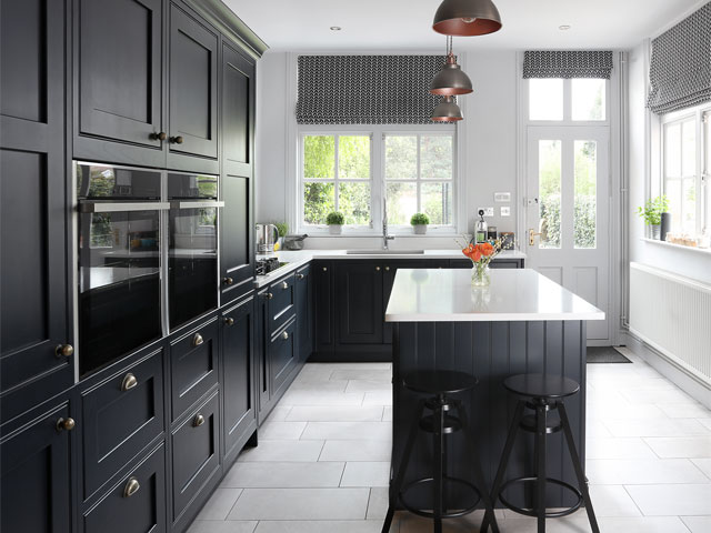 monochrome kitchen with matt black cabinets, white worktops and white walls