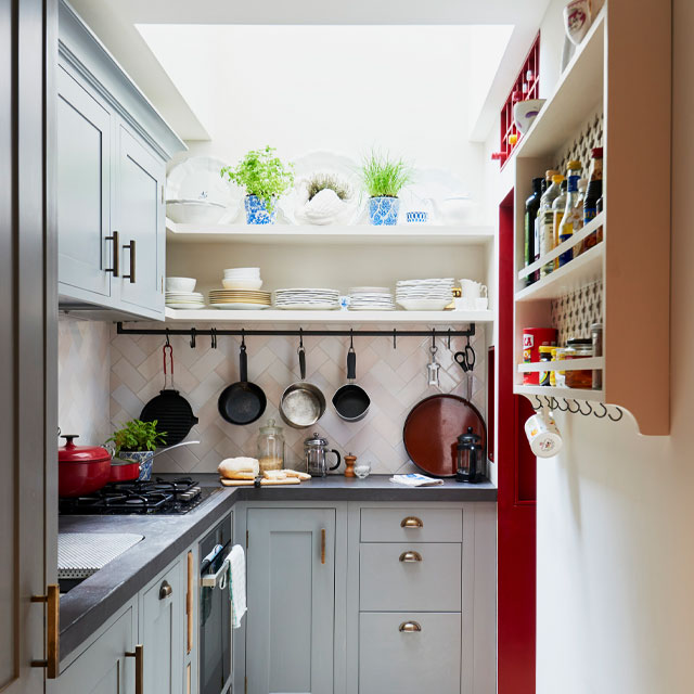 small kitchen with rooflight, pale green cabinets and open shelving